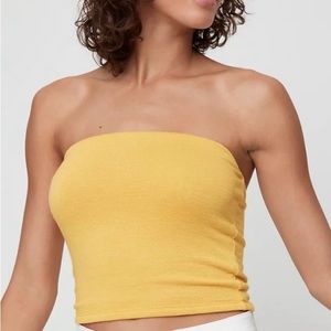 Yellow Aritzia tube top. Very comfortable. Stretchy . Stays up very well.